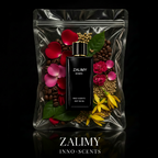 Zalimy perfume bottle surrounded by flowers and leaves on a reflective black surface